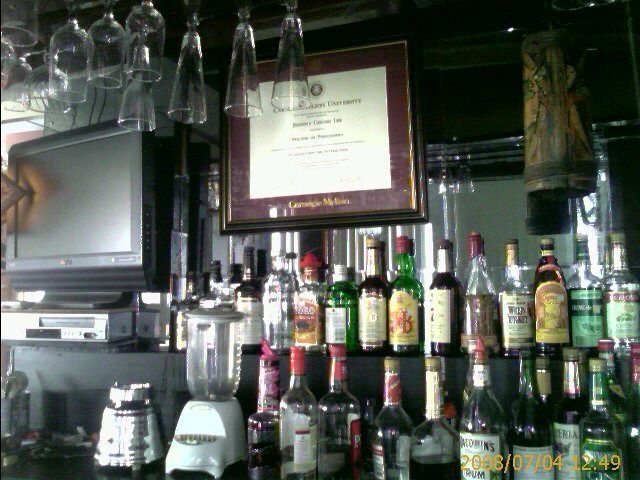 Johnny's diploma is up in the bar
