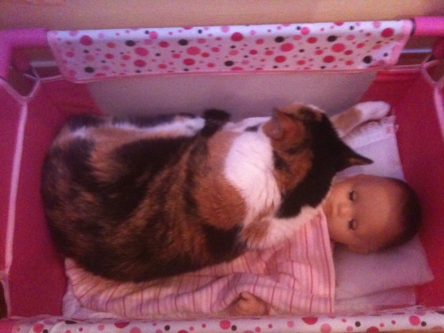 Elvira snuggles baby