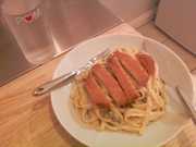 Fettucini alfredo w/peas and breaded chicken cutlet.
