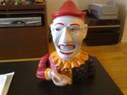Creepy clown bank eats your money